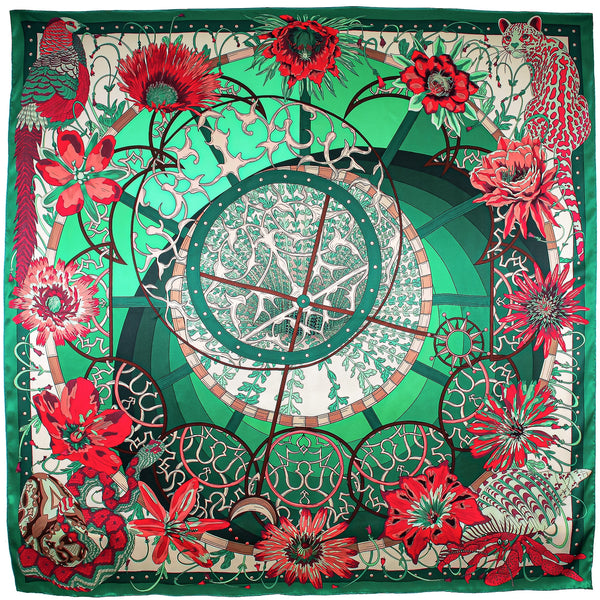 Vibrant emerald green square silk scarf featuring detailed flowers and animals illustration.