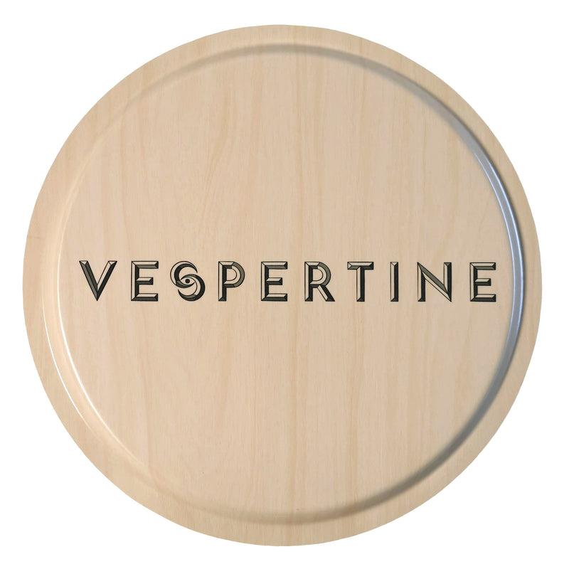 Back of birch wood tray with Vespertine emblem printed in the centre.